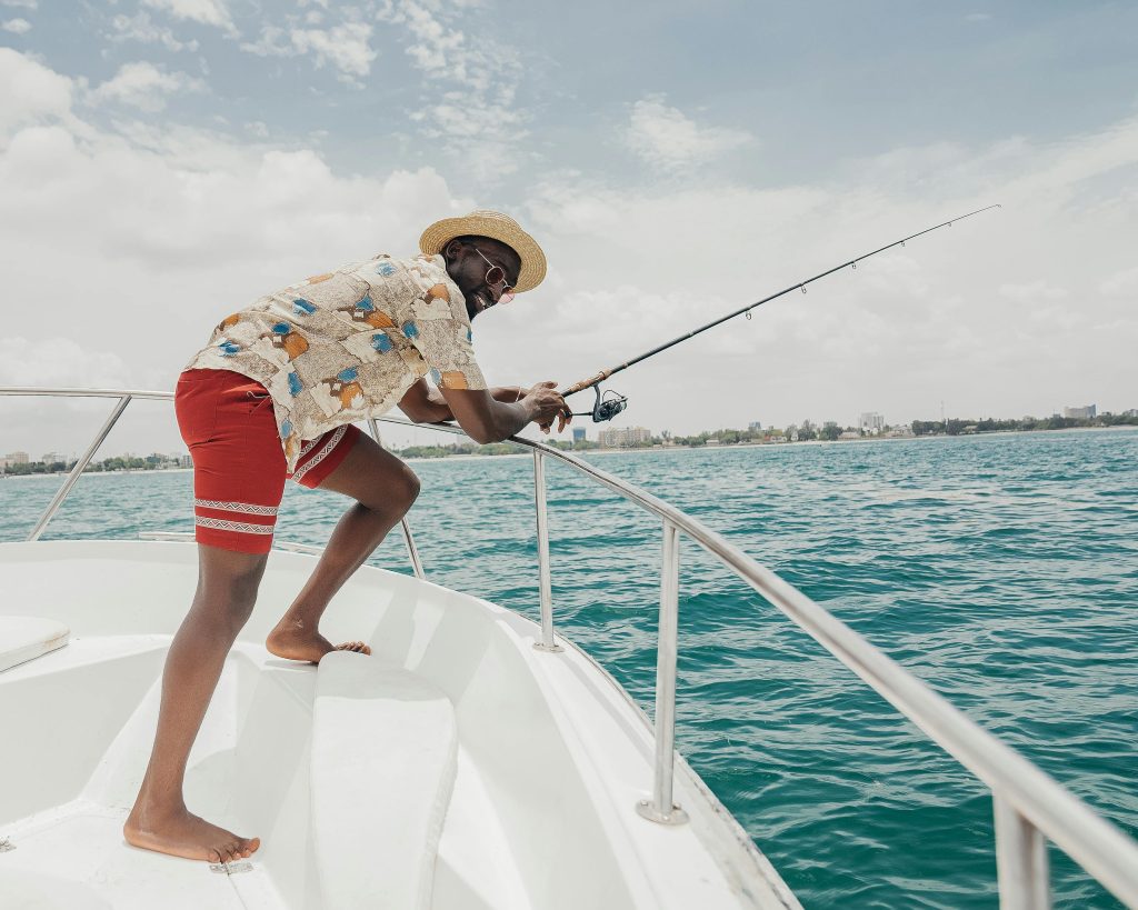 Man Fishing on a Yacht inTulum